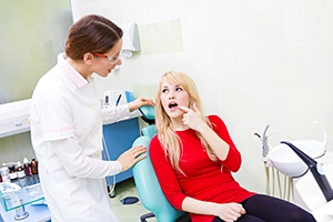 Patient in Toronto talking to dentist after dental implants