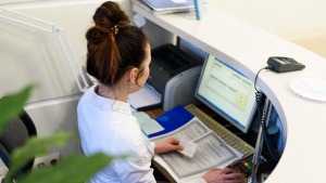 A front desk worker at a dental office